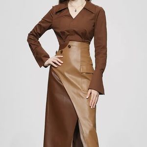 Beautiful 2 piece set with a high waisted faux leather skirt and matching shirt